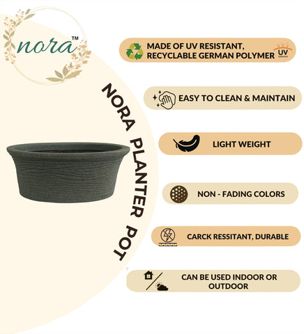 Nora Magnolia Pot, a dark grey, textured, shallow  roto molded marble look planter made of durable, UV-resistant, lightweight German polymer.