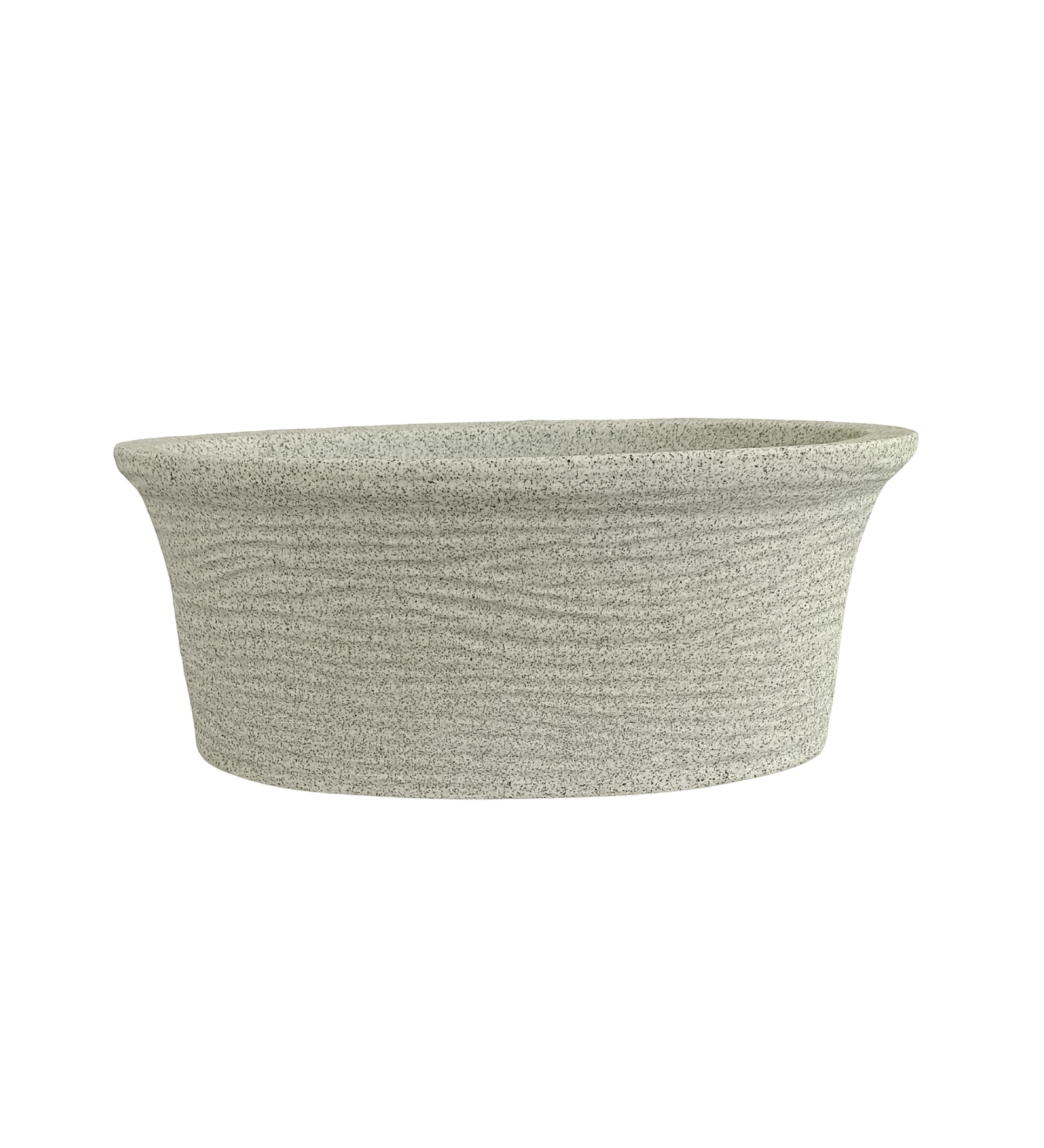Nora Magnolia Pot in a light grey roto molded planter pot  stone-textured finish with a wide shallow profile for indoor or outdoor plants.
