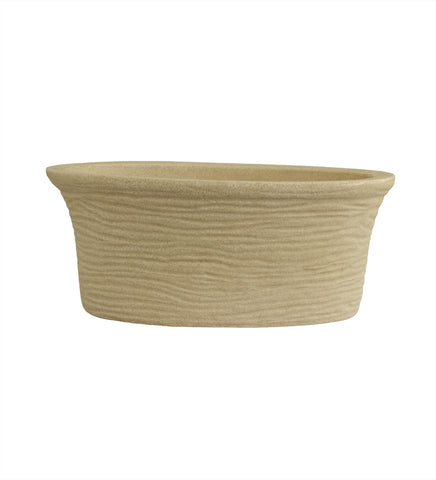 Nora Magnolia Pot with a textured beige stone-like finish roto molded planter pot  and a wide, shallow profile for indoor or outdoor plants.