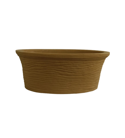 Nora Magnolia Pot in a shallow, earthy brown bowl shaped roto molded planter pot  with a textured, stone-like finish for indoor or outdoor use.