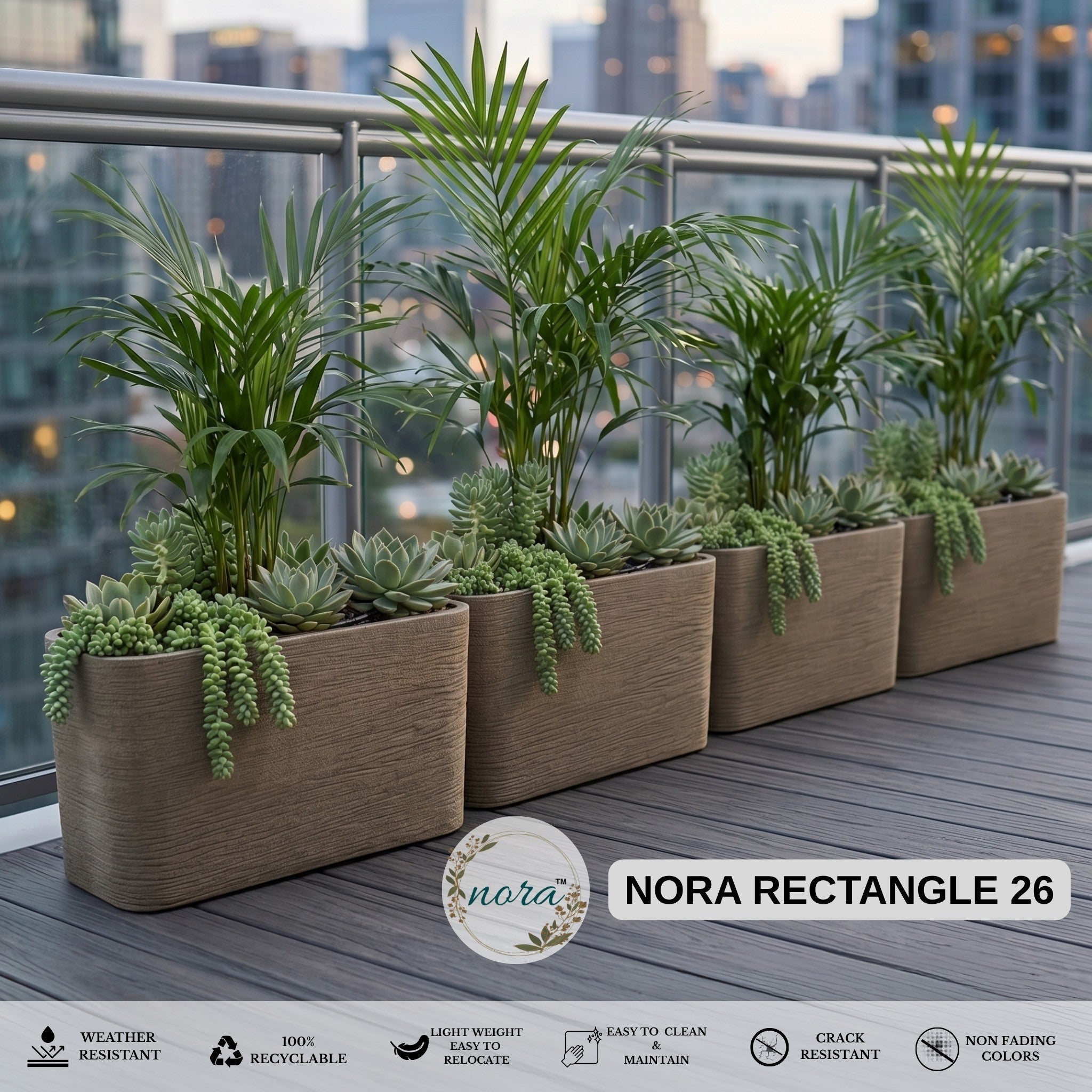Nora 26-inch rectangular planters with textured stone finish and lush green plants on a modern balcony.